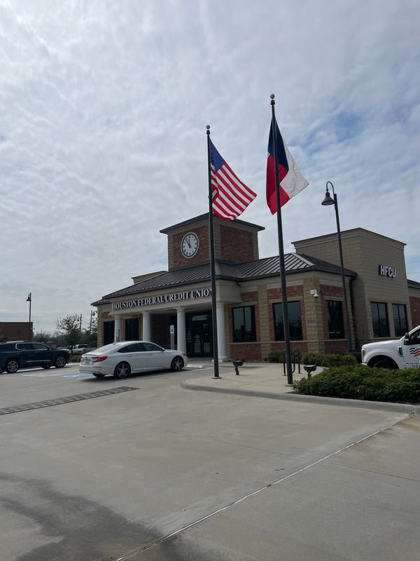 30'x6" bronze internal flagpoles. 5'x8' flags.